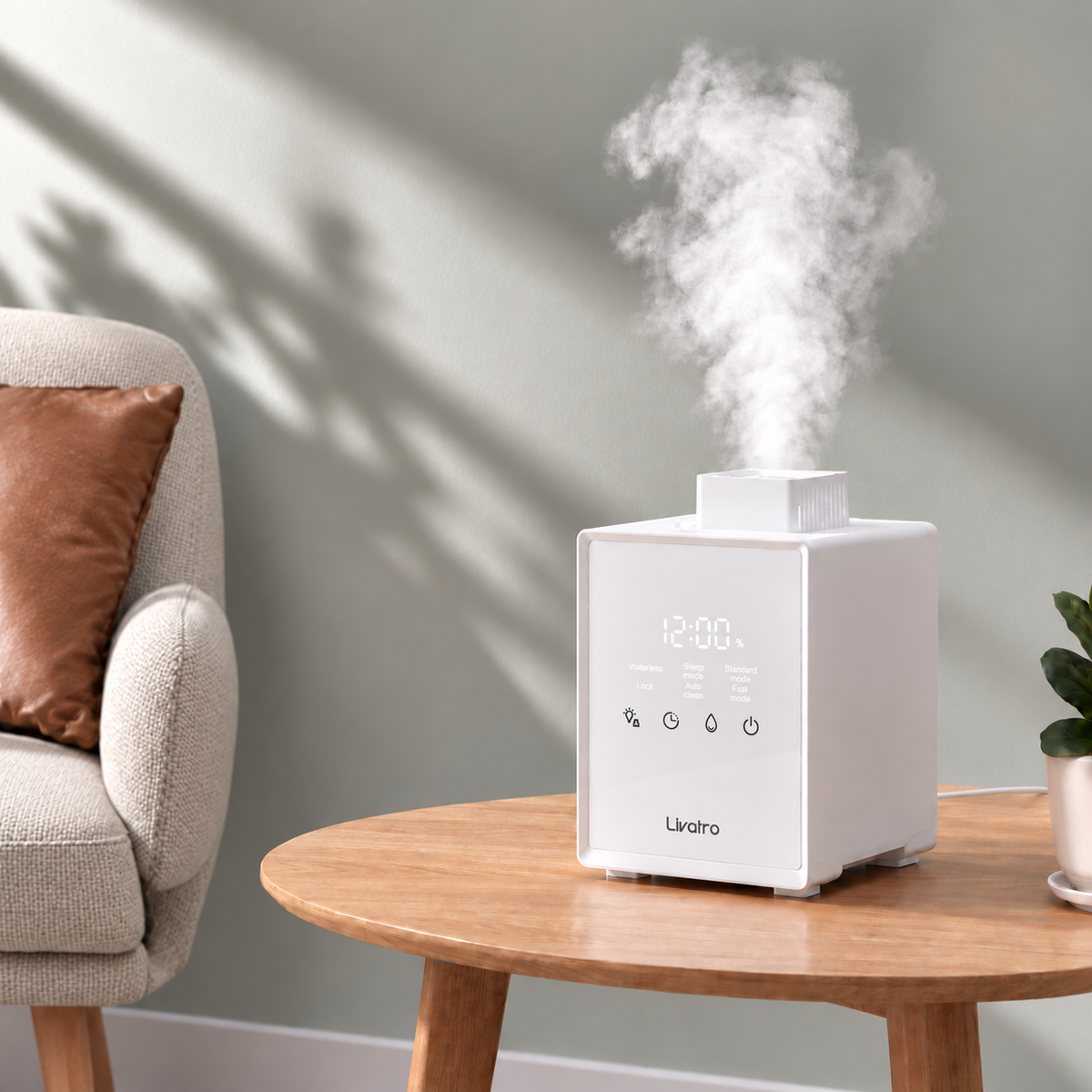 White Livatro 3L warm mist humidifier on a wooden table in a living room